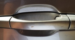 Remove scratches from car door handle
